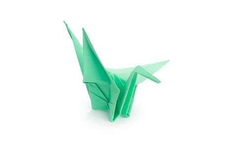 Premium Photo | Origami crane on white background