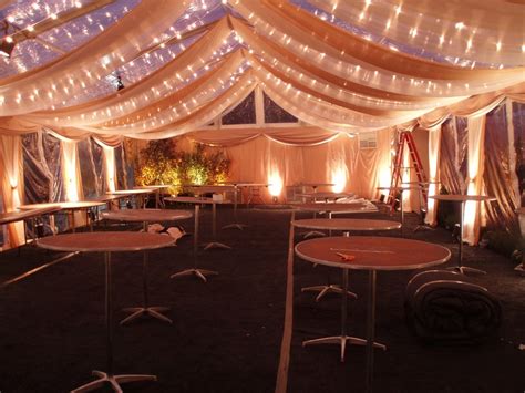 Clear tent with fabric swags and twinkle lights night time view | Tent reception, Clear tent ...