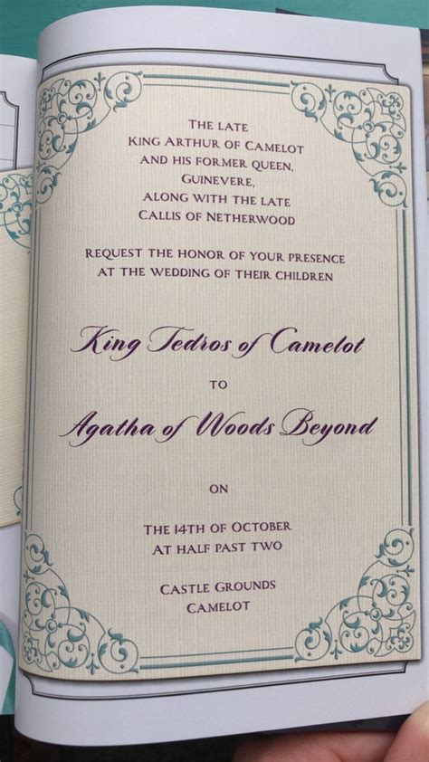 a hand holding an open book with the wedding program in it's center,