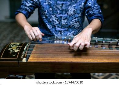 Playing Guzheng Images, Stock Photos & Vectors | Shutterstock