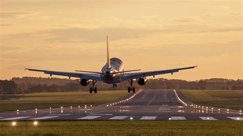 Airplane Taking Off Sunset