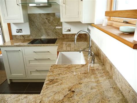 Polished Kashmir Gold Granite with cream cabinets | Granite worktops ...