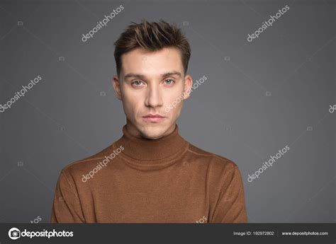 Handsome guy with solemn face Stock Photo by ©iakovenko123 192972802