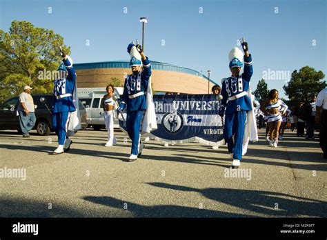 Members of the Hampton University marching band march to Armstrong Stadium for pre-game ...