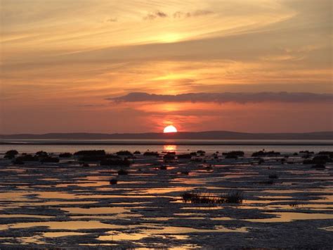 Morecambe Bay – Shades Of The Setting Sun | BaldHiker | Sunset, Beach shacks, England travel