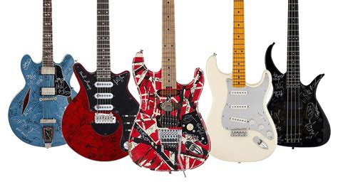 Guitars signed by Dave Grohl, Nile Rodgers, Brian Johnson, John Paul ...