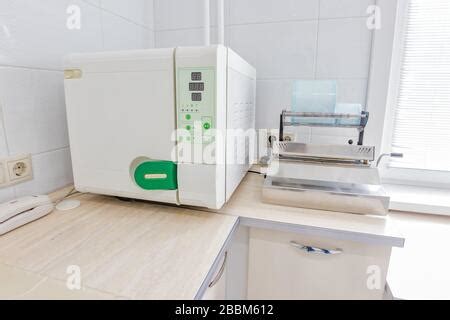 Nurse cleaning medical equipment in hospital Stock Photo - Alamy