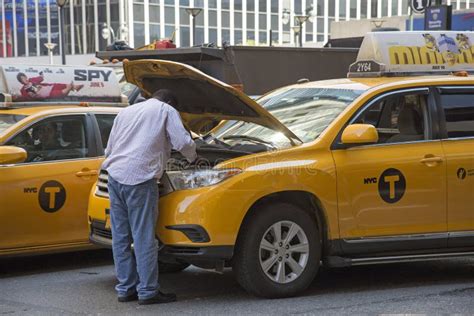 Yellow Cab Driver Looking at Engine of His Taxi Editorial Image - Image ...