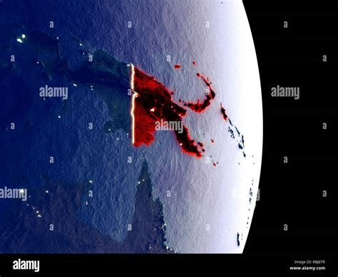 Satellite view of Papua New Guinea at night with visible bright city ...