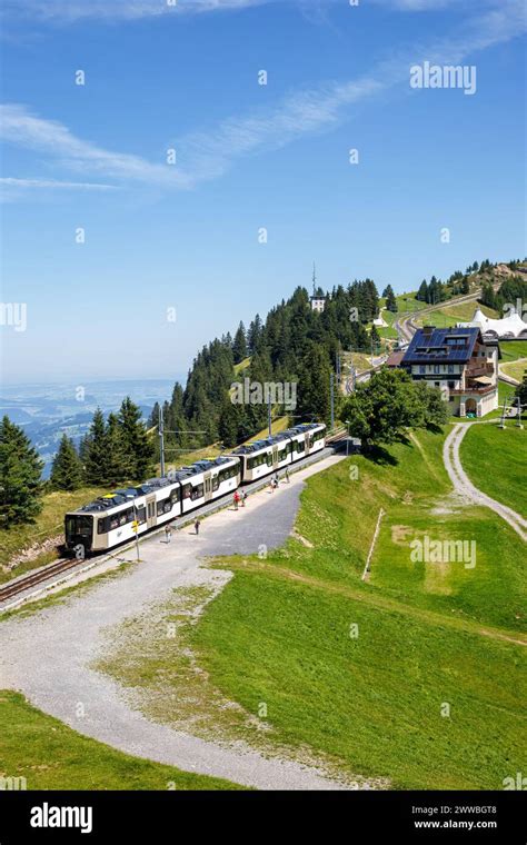 View on Rigi mountain and Arth–Rigi railway train line rack railway in Swiss Alps portrait ...