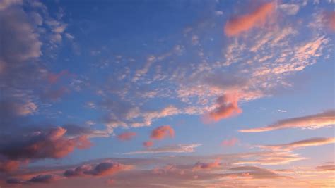 Early Morning. Blue Sky. Clouds, Illuminated By The Rising Sun Move In ...