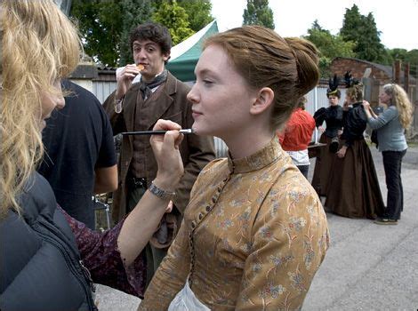 Olivia Hallinan, the actress who plays Laura Timmins during makeup touch ups, with John Dagleish ...