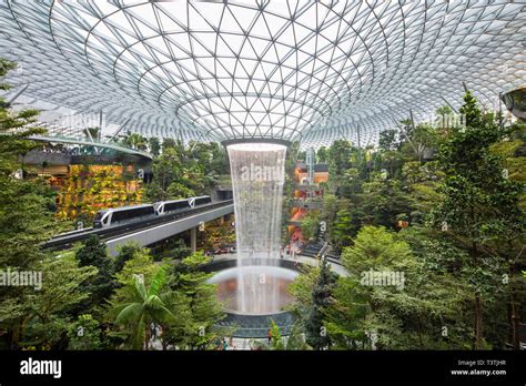 Lush view of Shiseido Forest Valley and the rain vortex at Jewel Changi ...