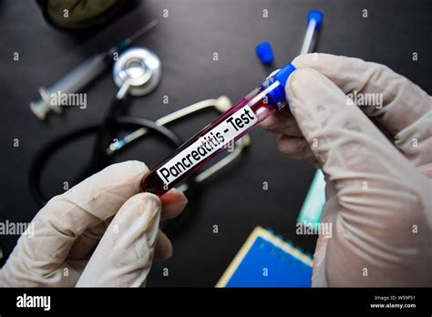 Pancreatitis - Test with blood sample. Top view isolated on black background. Healthcare/Medical ...