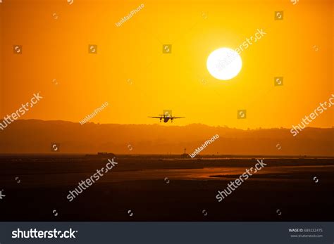 Airplane Taking Off Into Sunset Stock Photo 689232475 | Shutterstock