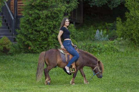 Woman riding a pony stock image. Image of female, girl - 249236693