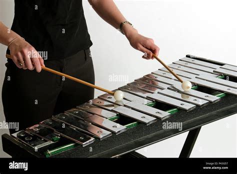 Glockenspiel with player holding the sticks on the instrument Stock Photo - Alamy