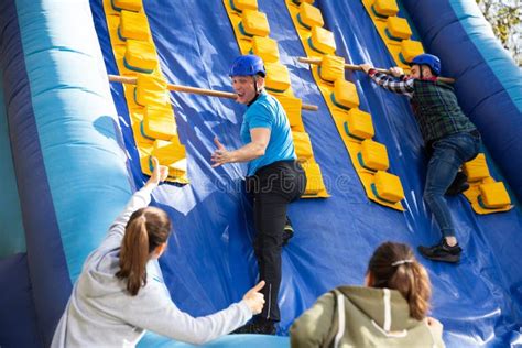 People Passing Obstacles on Inflatable Arena at Amusement Park Stock Image - Image of excited ...