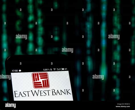 East West Bank logo seen displayed on a smart phone Stock Photo - Alamy