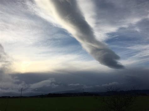 Gobsmacked photographer captures spectacular 'hand of God' emerging from cloudy skies in ...