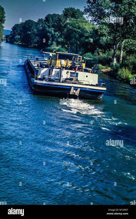 European river cruise and commercial barges Stock Photo - Alamy