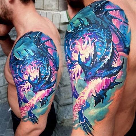 Amazing colors in this flying, fire breathing dragon. Done on guy's shoulder & upper arm by ...