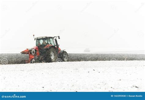 Tractor plowing a field stock photo. Image of machine - 142295938