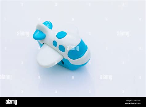 Plastic blue and white toy airplane jet isolated with shadow on a white background Stock Photo ...