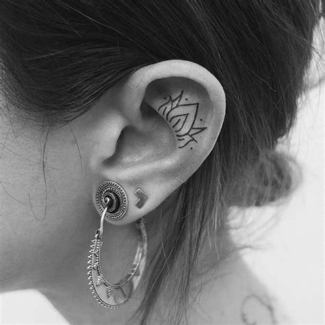 Step up your ear game: the helix tattoo