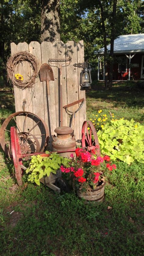 Old rusty garden tools & iron wheels | Country garden decor, Yard art, Garden art