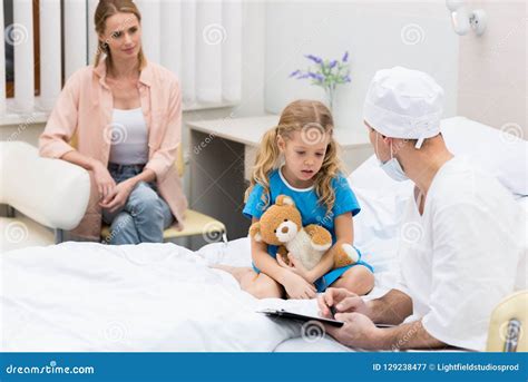 Doctor Talking with Kid and Sitting Stock Image - Image of medicare, female: 129238477