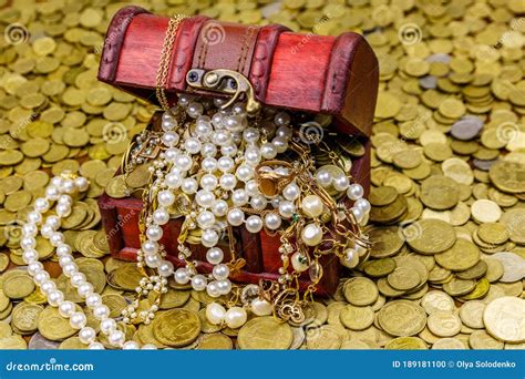 Vintage Treasure Chest Full of Gold Coins and Jewelry on a Background ...