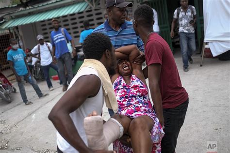 Tensions grow in Haiti over slow pace of aid after quake — AP Photos