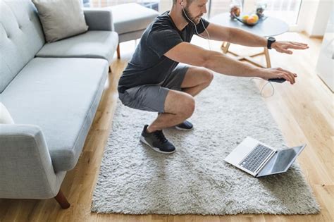 Premium Photo | Handsome man working out at home