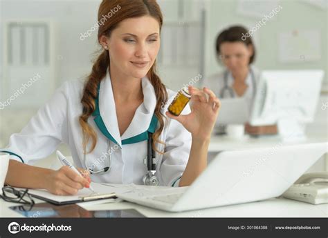 Doctor Sitting Desk Work Hospital Stock Photo by ©aletia 301064388