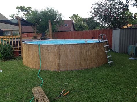 Diy camoflauge above ground pool with bamboo or reed fencing | Diy pool ...