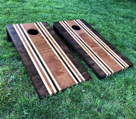 two wooden boards laying on top of green grass