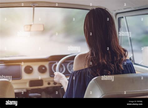 young woman driving a vintage car Stock Photo - Alamy