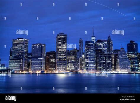 Lower Manhattan skyline at night Stock Photo - Alamy