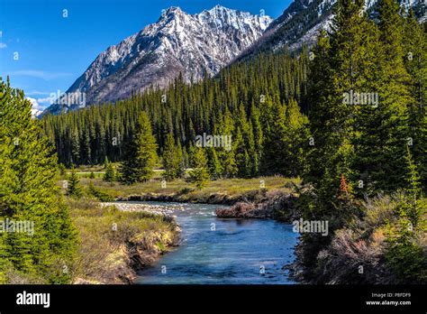 Mountain scene whre river flowes towards camera and mountains in ...