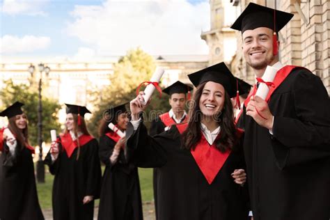 Happy Students with Diplomas. Graduation Ceremony Stock Image - Image of board, male: 163002433