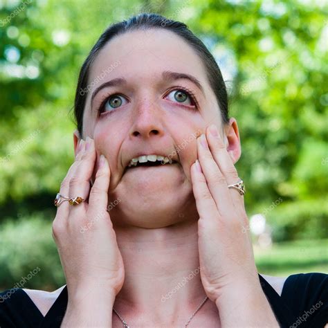 Expression-Young woman making a funny grimace — Stock Photo © ilolab #7209619