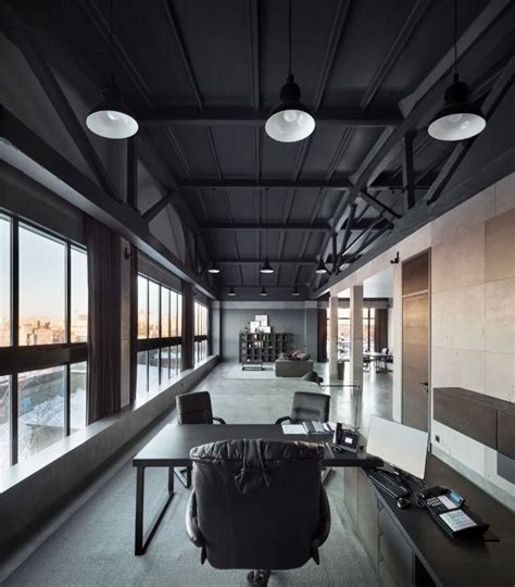 Modern Industrial Office Design with Black Ceiling and Lots of Windows