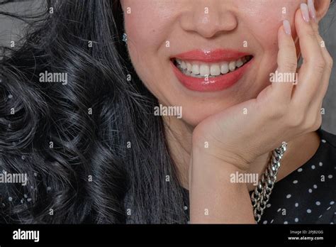 the smile of a girl with white teeth Stock Photo - Alamy