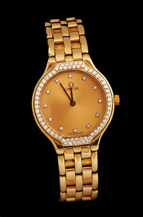 #53: LADIES' OMEGA DEVILLE 18K GOLD WATCH WITH DIAMONDS