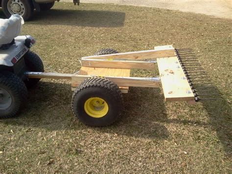 Pinestraw rake in dump position | Homemade tractor, Garden tractor attachments, Tractor attachments