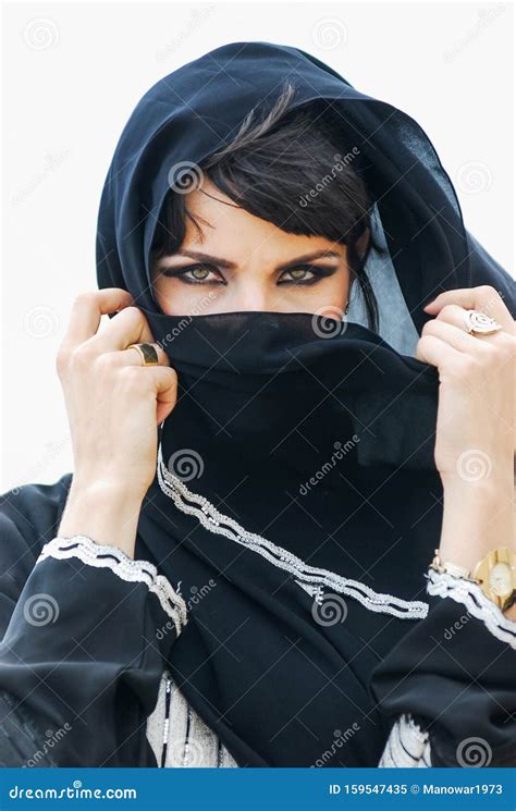 Portrait of an Arabic Young Woman with Her Beautiful Blue Eyes in Traditional Middle Eastern ...