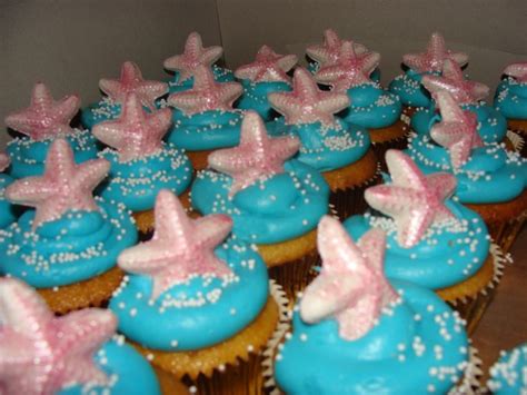Gold cupcake with buttercream frosting and white chocolate starfish | Buttercream frosting for ...