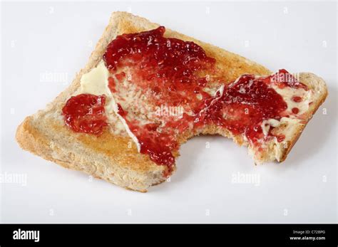 Buttered toast and strawberry jam Stock Photo - Alamy