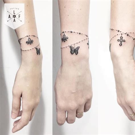 Butterfly and Cross Bracelet Tattoo Designs | Tatuajes femeninos en la muñeca, Tatuaje en la ...